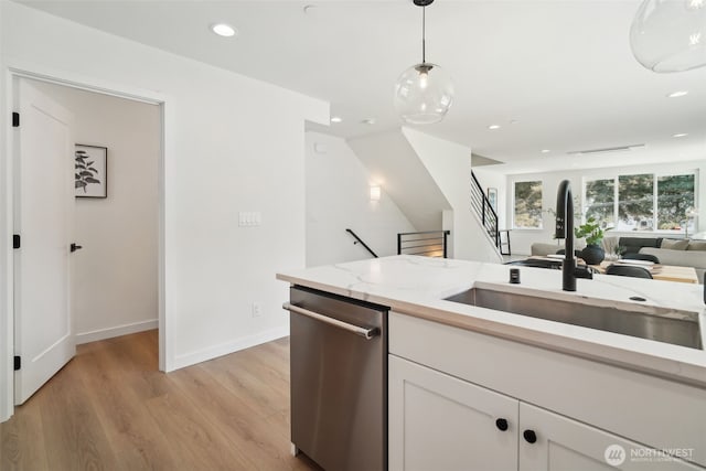 20315 14th Ave NE Unit A & B, Shoreline, WA 98155 - kitchen featuring stainless steel dishwasher, a sink, light wood-type flooring, recessed lighting, and white cabinets