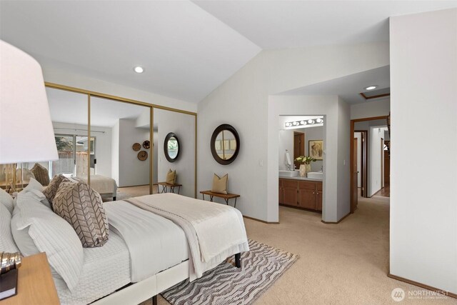 12731 102nd Ave NE, Kirkland, WA 98034 - bedroom with lofted ceiling, light carpet, ensuite bathroom, a closet, and baseboards