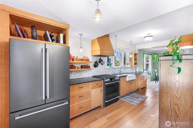 2218 Williams St, Bellingham, WA 98225 - kitchen with freestanding refrigerator, open shelves, range with gas stovetop, premium range hood, and a sink