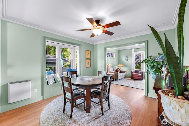 2218 Williams St, Bellingham, WA 98225 - dining space with a ceiling fan, light wood finished floors, ornamental molding, heating unit, and baseboards