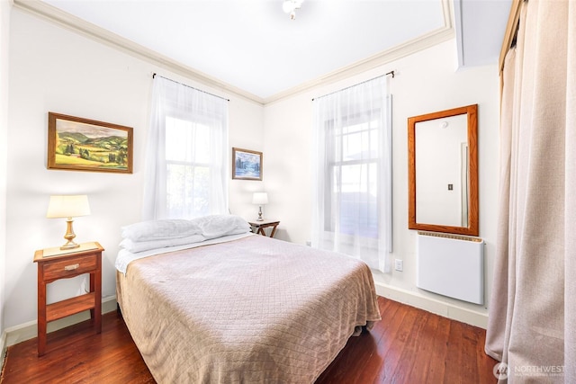 2218 Williams St, Bellingham, WA 98225 - bedroom with radiator heating unit, crown molding, dark wood-type flooring, and baseboards