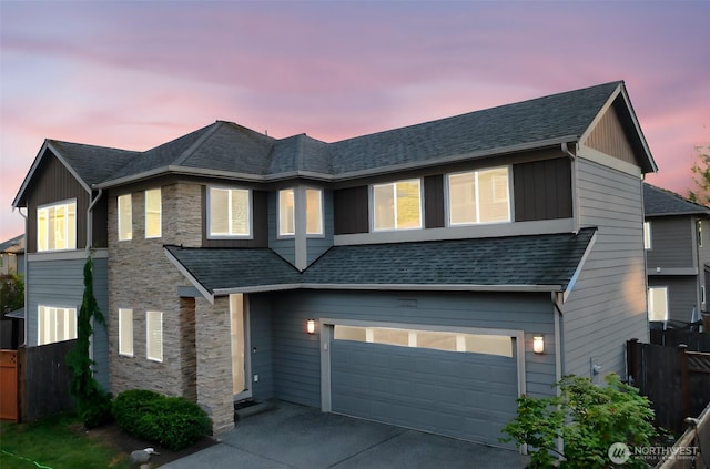 4408 214th Pl SE, Bothell, WA 98021 - view of front of property featuring a garage, stone siding, concrete driveway, and a shingled roof