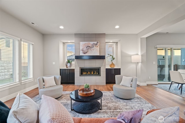 4408 214th Pl SE, Bothell, WA 98021 - living area with baseboards, light wood finished floors, recessed lighting, and a fireplace