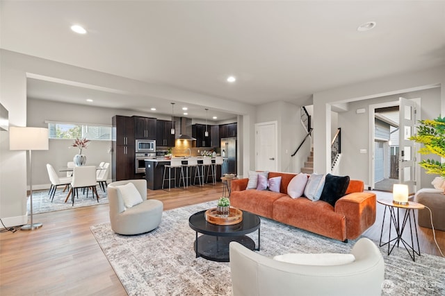 4408 214th Pl SE, Bothell, WA 98021 - living area featuring light wood-style floors, stairway, recessed lighting, and baseboards