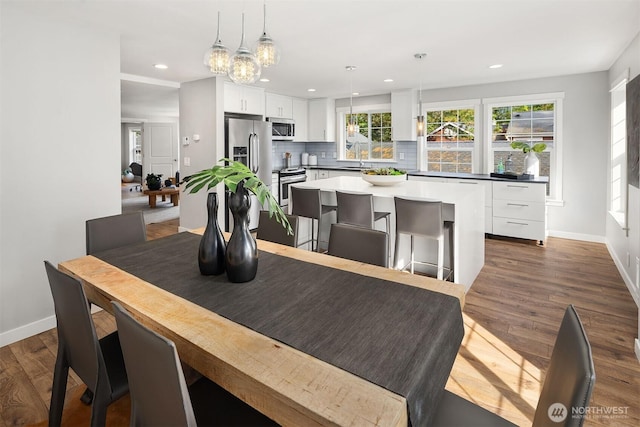 3046 128th Ave SE Unit 30, Bellevue, WA 98005 - dining room featuring baseboards, dark wood-type flooring, a chandelier, and recessed lighting