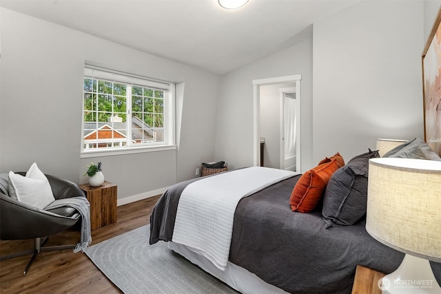 3046 128th Ave SE Unit 30, Bellevue, WA 98005 - bedroom with lofted ceiling, wood finished floors, and baseboards