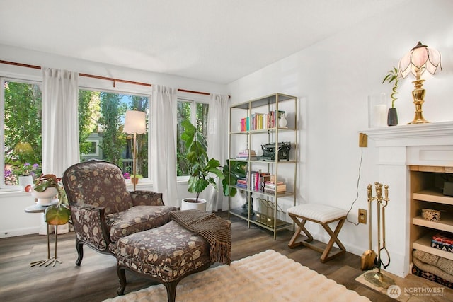 3505 W Government Way Unit 203, Seattle, WA 98199 - sitting room with wood finished floors and baseboards
