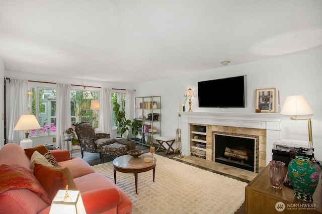 3505 W Government Way Unit 203, Seattle, WA 98199 - living area with a tile fireplace and wood finished floors