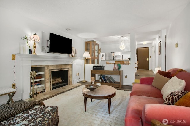 3505 W Government Way Unit 203, Seattle, WA 98199 - living area featuring wood finished floors, a fireplace, and baseboards