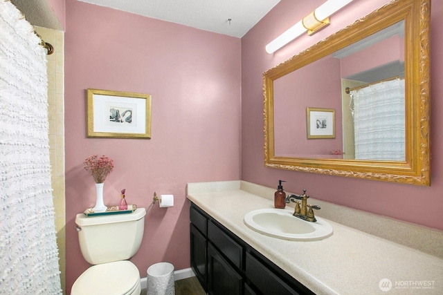 3505 W Government Way Unit 203, Seattle, WA 98199 - bathroom with vanity, toilet, and curtained shower