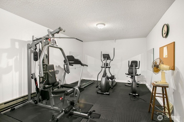 3505 W Government Way Unit 203, Seattle, WA 98199 - workout room with a textured ceiling and baseboards