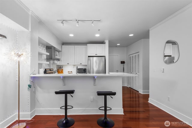19500 Ballinger Way NE Unit 109, Shoreline, WA 98155 - kitchen featuring stainless steel refrigerator, wall chimney exhaust hood, a peninsula, open shelves, and dark wood-type flooring