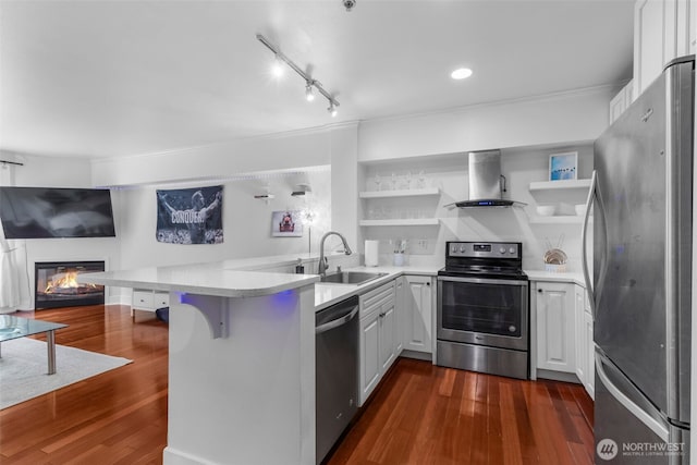 19500 Ballinger Way NE Unit 109, Shoreline, WA 98155 - kitchen with stainless steel appliances, exhaust hood, a sink, open shelves, and a peninsula