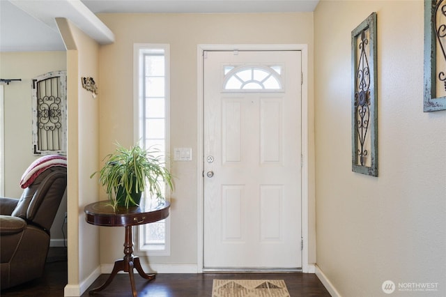 1183 E.9 Rd NE, Moses Lake, WA 98837 - entryway with dark wood finished floors, baseboards, and arched walkways