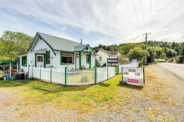 16672 Frontier St, Clallam Bay, WA 98326 - view of front facade featuring a standing seam roof and metal roof
