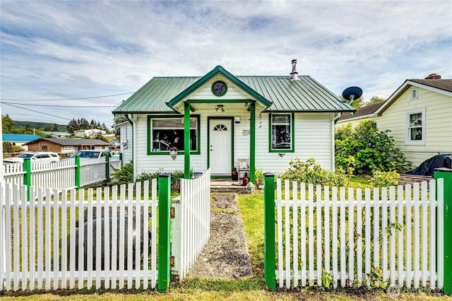 16672 Frontier St, Clallam Bay, WA 98326 - bungalow-style home featuring metal roof and a fenced front yard