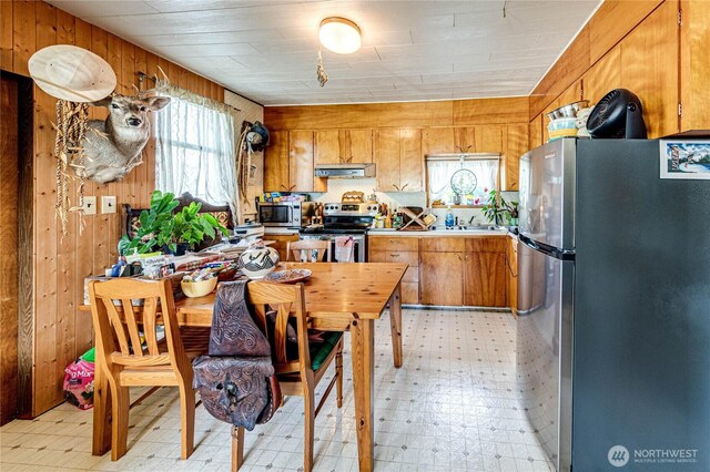 16672 Frontier St, Clallam Bay, WA 98326 - dining area featuring light flooring and wood walls
