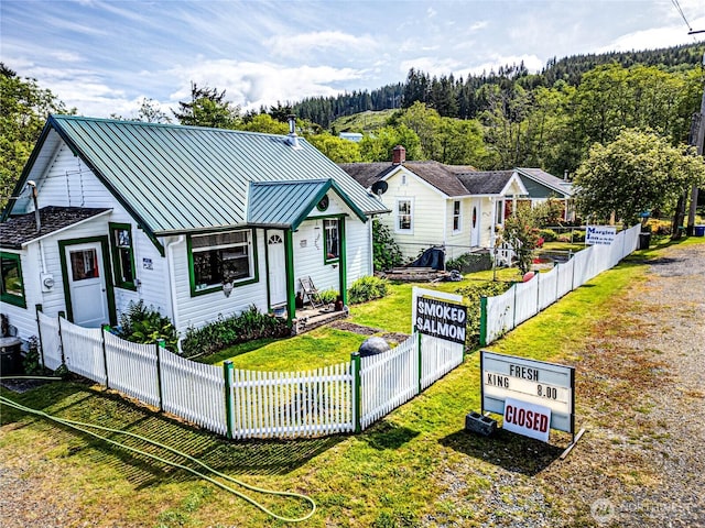16672 Frontier St, Clallam Bay, WA 98326 - view of front of home featuring a standing seam roof, metal roof, and gravel driveway