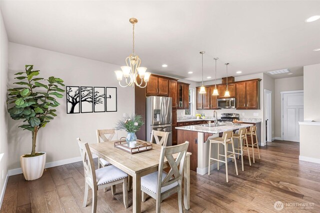 3860 Lindsay Ave, Bellingham, WA 98229 - dining area with hardwood / wood-style floors, recessed lighting, baseboards, and a chandelier