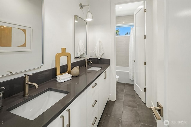 5822 56th Ave NE, Seattle, WA 98105 - bathroom featuring double vanity, shower / bathtub combination with curtain, and tile patterned floors
