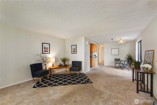 24727 12th Ave S, Des Moines, WA 98198 - sitting room featuring light colored carpet, a textured ceiling, and baseboards