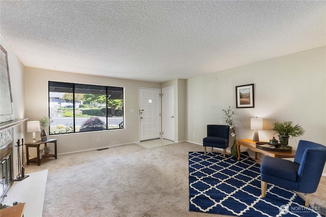24727 12th Ave S, Des Moines, WA 98198 - carpeted living room with a textured ceiling, a high end fireplace, and baseboards