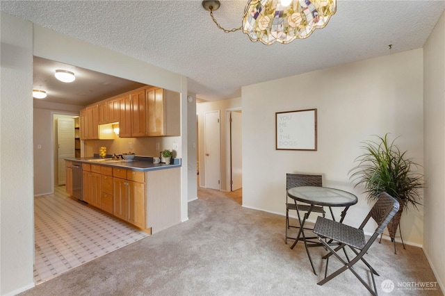 24727 12th Ave S, Des Moines, WA 98198 - kitchen with stainless steel dishwasher, light colored carpet, a chandelier, a sink, and a textured ceiling