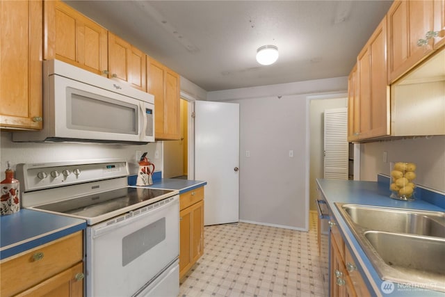 24727 12th Ave S, Des Moines, WA 98198 - kitchen featuring white appliances, light floors, and a sink