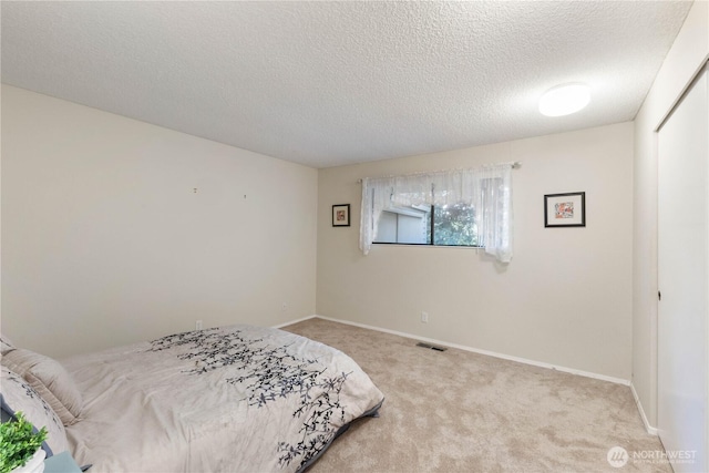 24727 12th Ave S, Des Moines, WA 98198 - carpeted bedroom featuring baseboards and a textured ceiling