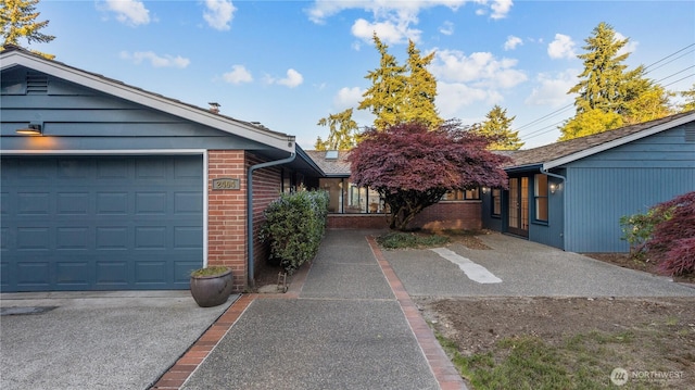2404 79th Ave NE, Medina, WA 98039 - view of side of home with brick siding and an attached garage