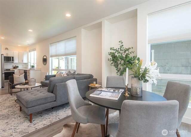 13713 35th Ave NE Unit A, Seattle, WA 98125 - dining space with light wood-type flooring and recessed lighting