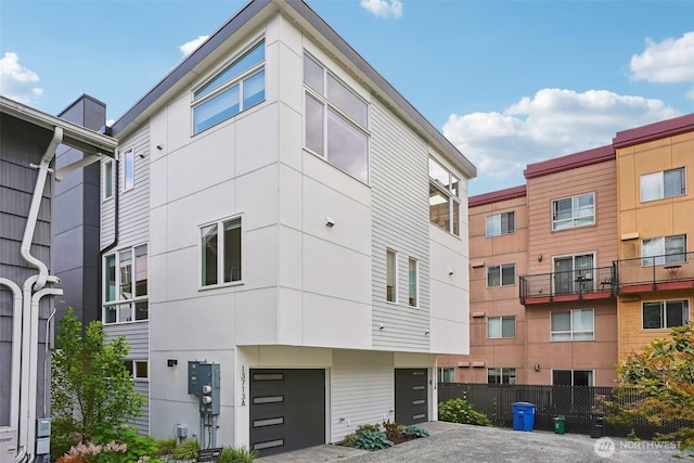 13713 35th Ave NE Unit A, Seattle, WA 98125 - view of building exterior featuring a garage