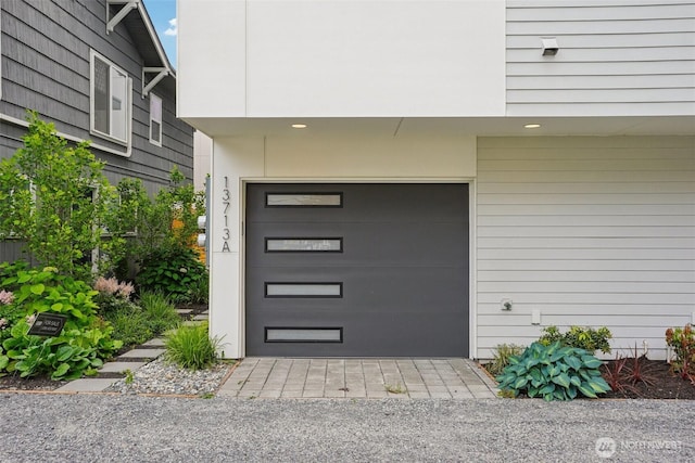 13713 35th Ave NE Unit A, Seattle, WA 98125 - view of exterior entry featuring a garage