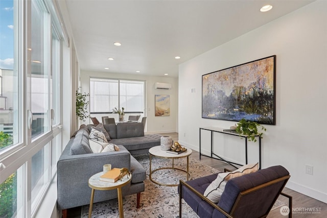 13713 35th Ave NE Unit A, Seattle, WA 98125 - living room featuring wood finished floors, recessed lighting, and an AC wall unit