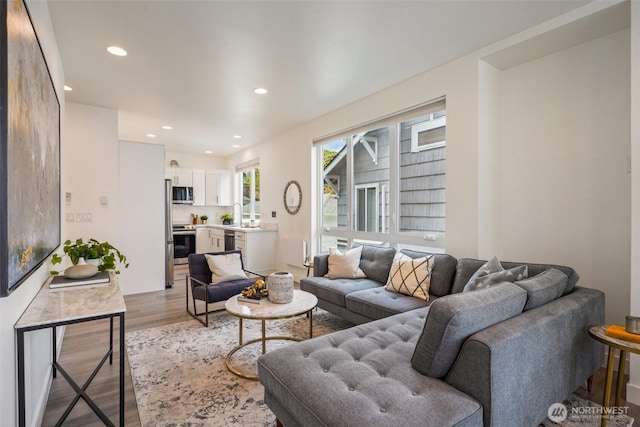 13713 35th Ave NE Unit A, Seattle, WA 98125 - living room featuring wood finished floors and recessed lighting