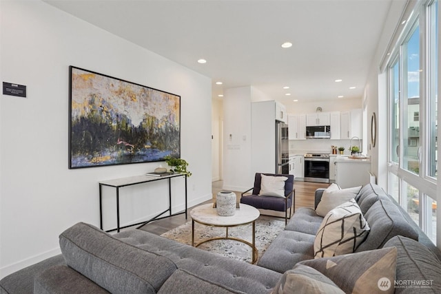 13713 35th Ave NE Unit A, Seattle, WA 98125 - living area with wood finished floors and recessed lighting