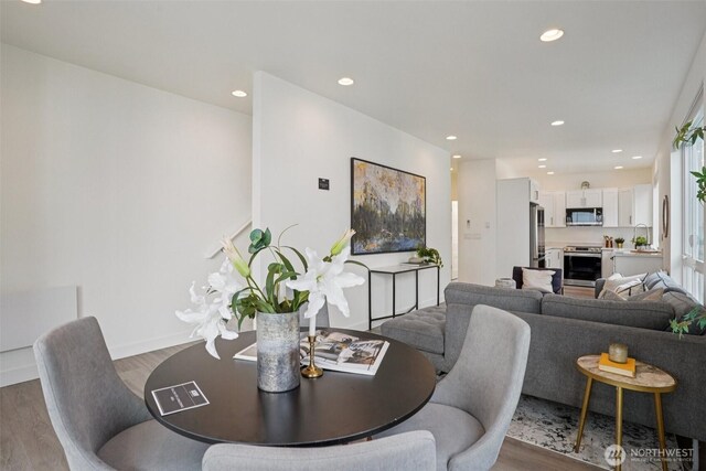 13713 35th Ave NE Unit A, Seattle, WA 98125 - dining space featuring wood finished floors and recessed lighting