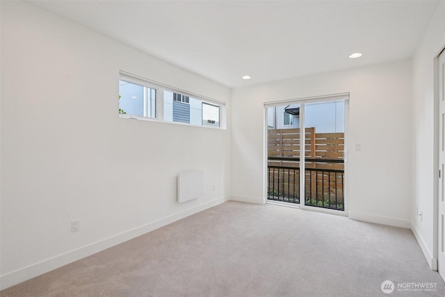 13713 35th Ave NE Unit A, Seattle, WA 98125 - carpeted spare room featuring baseboards and recessed lighting