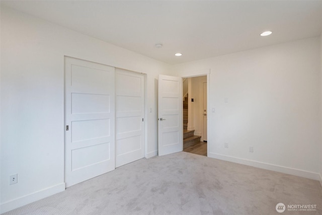 13713 35th Ave NE Unit A, Seattle, WA 98125 - unfurnished bedroom with carpet floors, a closet, and recessed lighting