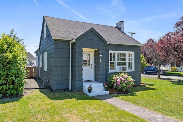 121 SW Alfred Ave, Chehalis, WA 98532 - bungalow-style home with a shingled roof, a chimney, and cooling unit