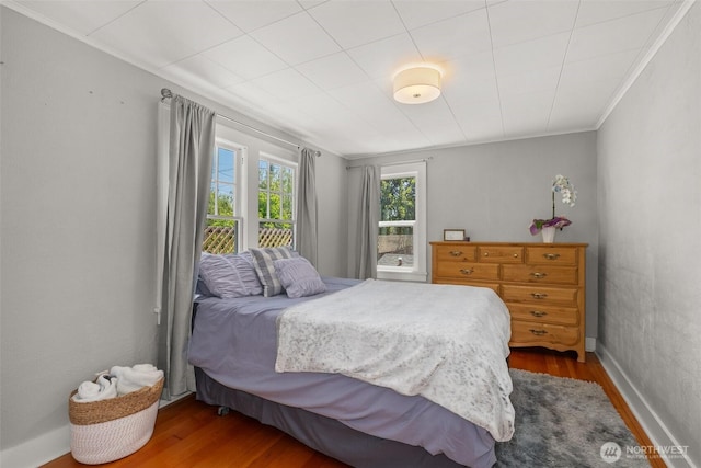 121 SW Alfred Ave, Chehalis, WA 98532 - bedroom featuring wood finished floors, crown molding, and baseboards