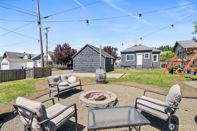 121 SW Alfred Ave, Chehalis, WA 98532 - view of patio / terrace featuring a playground, an outdoor living space with a fire pit, and a residential view
