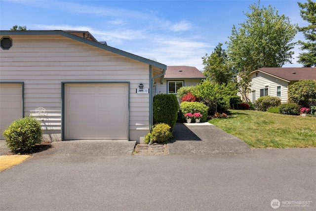 24831 110th Pl SE Unit 51D, Kent, WA 98030 - view of front facade with a front yard, asphalt driveway, and an attached garage