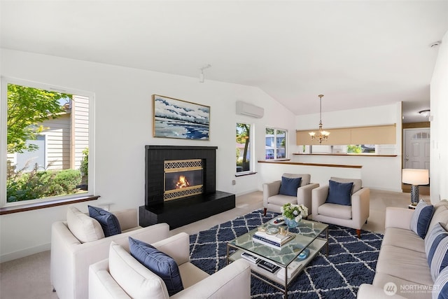 24831 110th Pl SE Unit 51D, Kent, WA 98030 - carpeted living area featuring vaulted ceiling, a chandelier, a wall mounted air conditioner, a glass covered fireplace, and baseboards