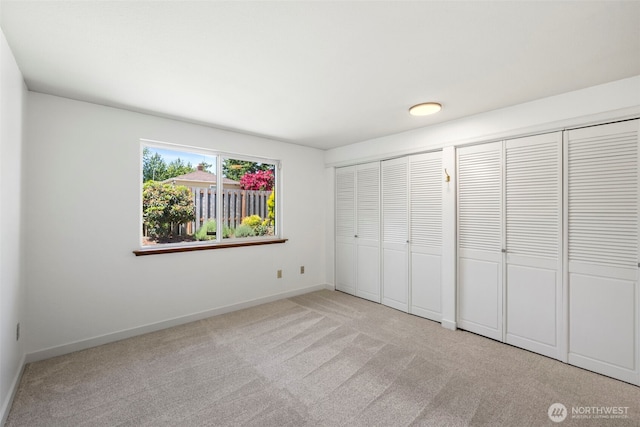 24831 110th Pl SE Unit 51D, Kent, WA 98030 - unfurnished bedroom with light colored carpet and baseboards