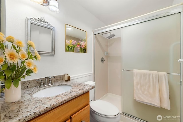24831 110th Pl SE Unit 51D, Kent, WA 98030 - bathroom featuring a stall shower, vanity, and toilet