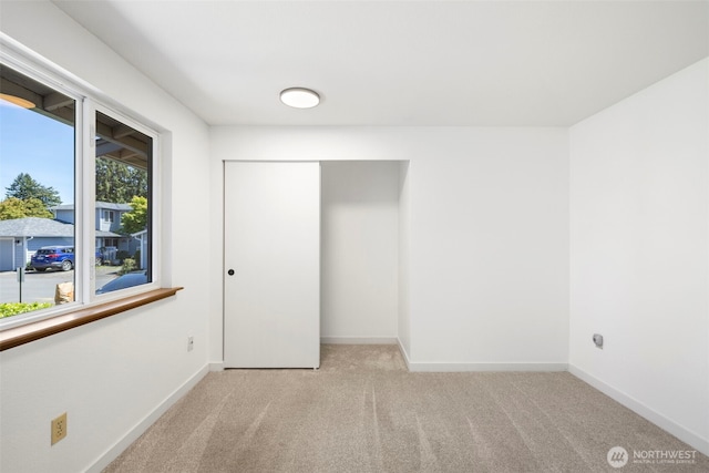 24831 110th Pl SE Unit 51D, Kent, WA 98030 - unfurnished bedroom with carpet, baseboards, and a closet