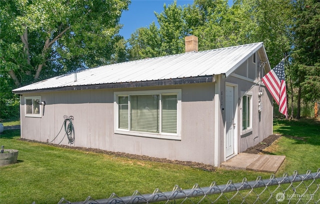 632 Dayton St, Omak, WA 98841 - view of home's exterior featuring a chimney and metal roof