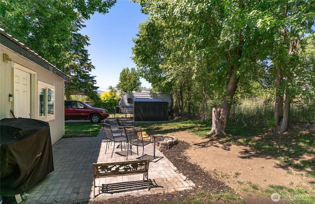 632 Dayton St, Omak, WA 98841 - view of yard featuring a patio and an outdoor fire pit