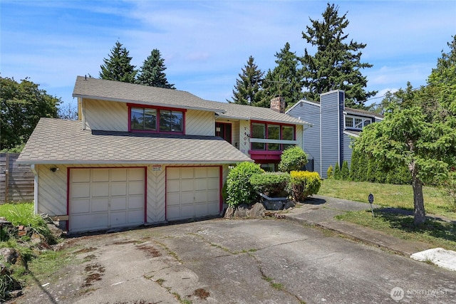 7407 25th Ave NE, Seattle, WA 98115 - view of front of home featuring driveway, a shingled roof, a chimney, and an attached garage